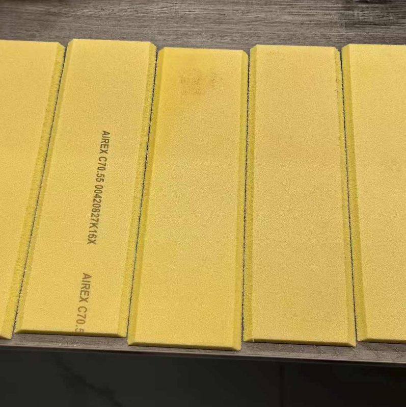 Image of multiple consistently cut PVC foam strips with tight tolerances, stacked neatly, ideal for use as seals, edges, or reinforcement strips.